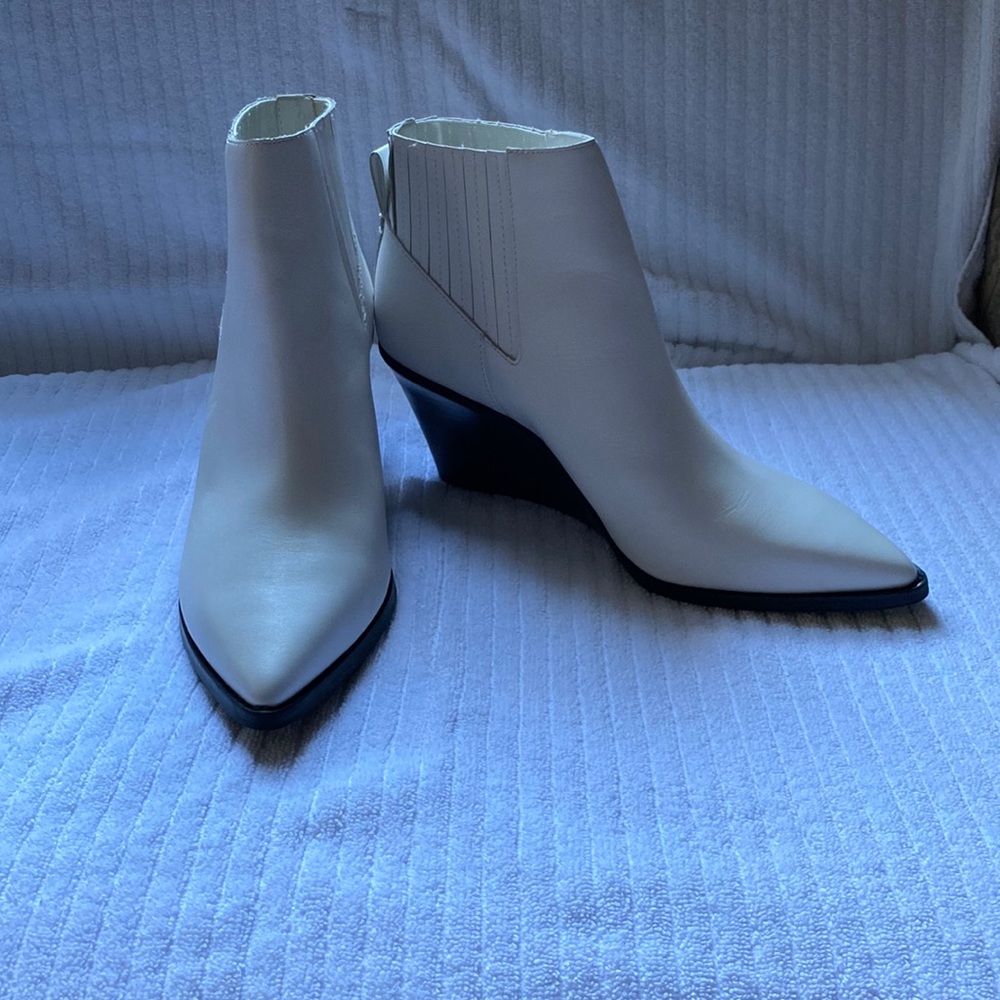 Calvin Klein white ankle boots.